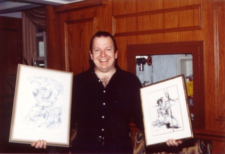 Mike Grell showing off some of his Tarzan art